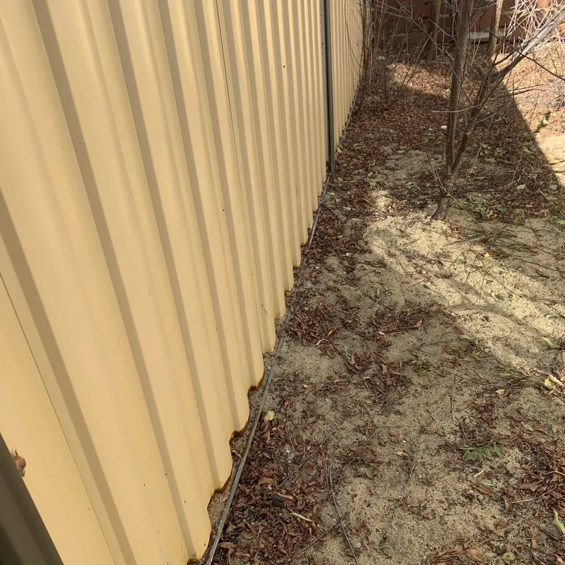 Cream Colorbond fence line